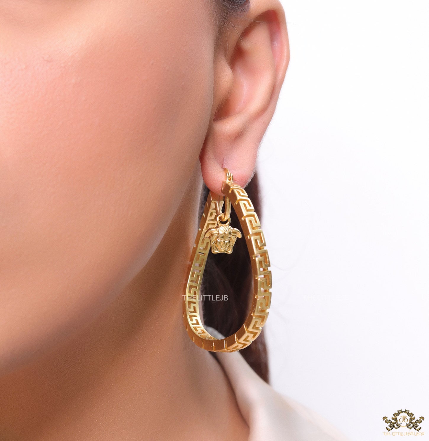 Designer golden twisted hoops 52 mm