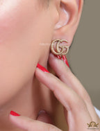 Gold plated earrings with double G initials