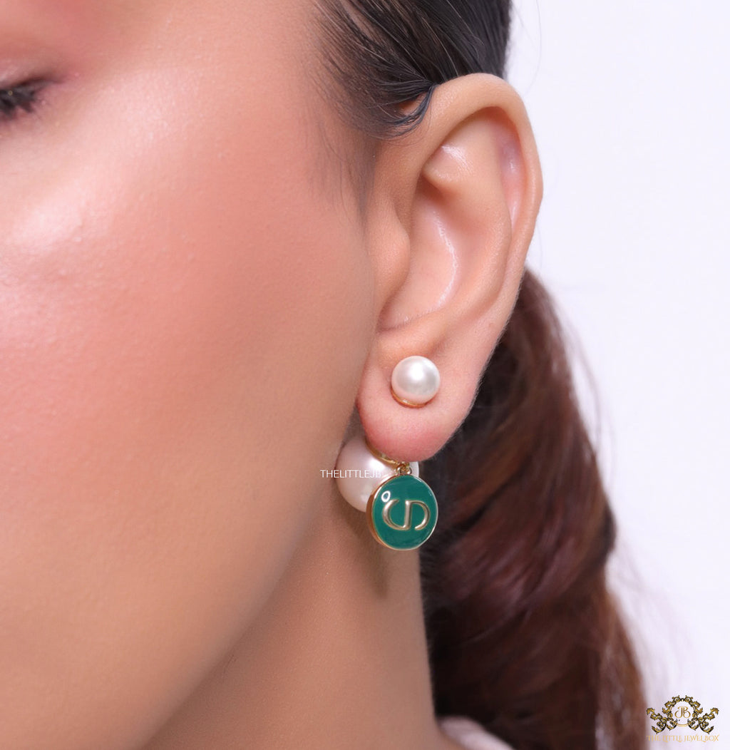 Golden pearl bomber earrings with green alphabet drop