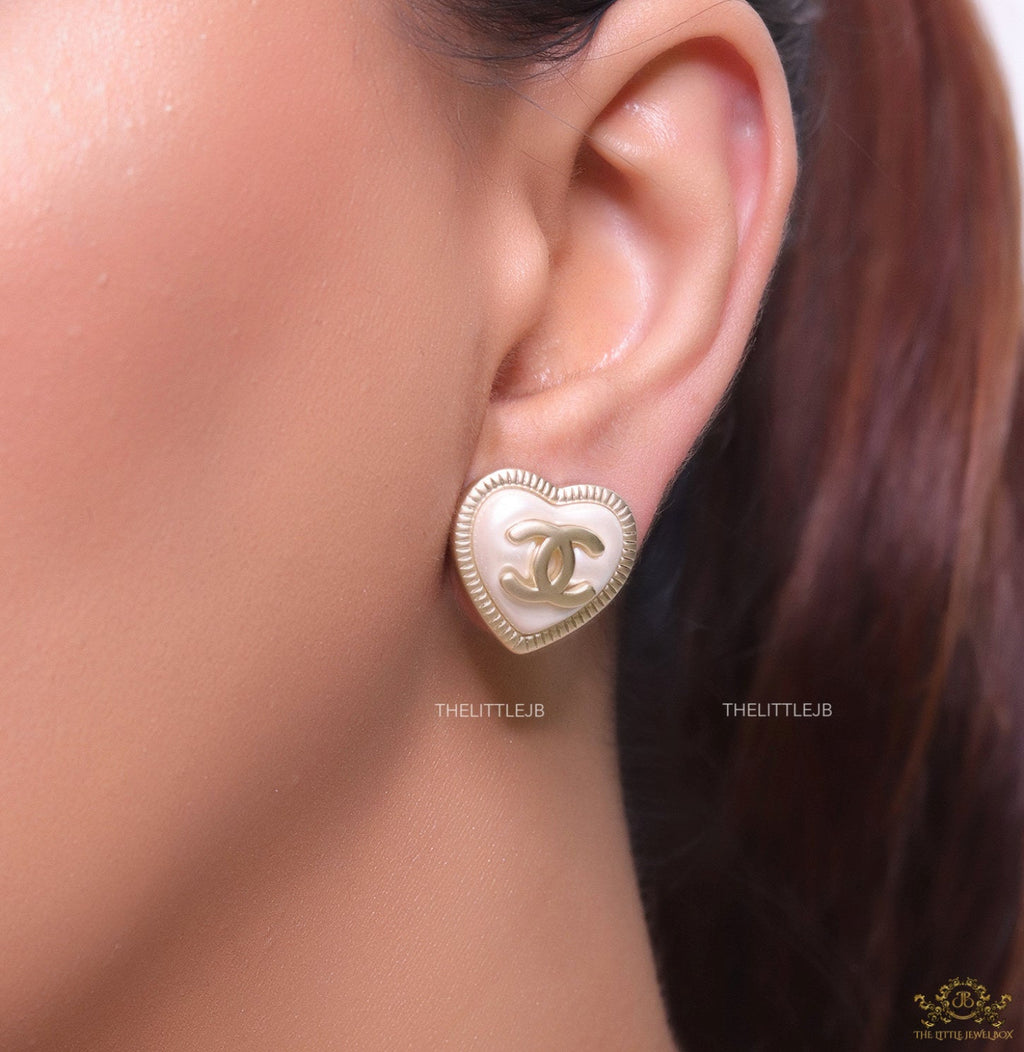 Heart shape twin C motif golden studs with pearl base