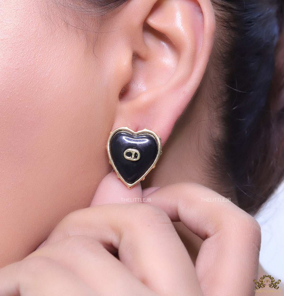 Heart shape black stud earrings with golden alphabets