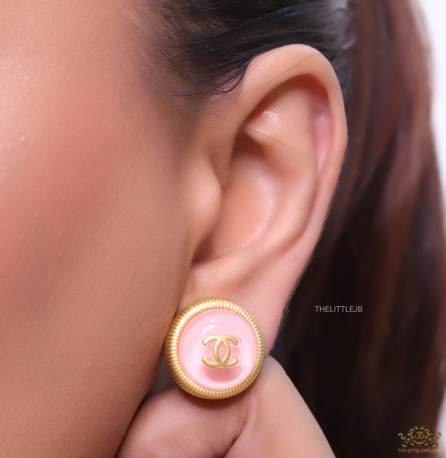 Pink and golden round studs with twin C motif