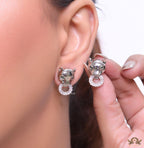 Platinum plated panther face studs with cz baguette ring