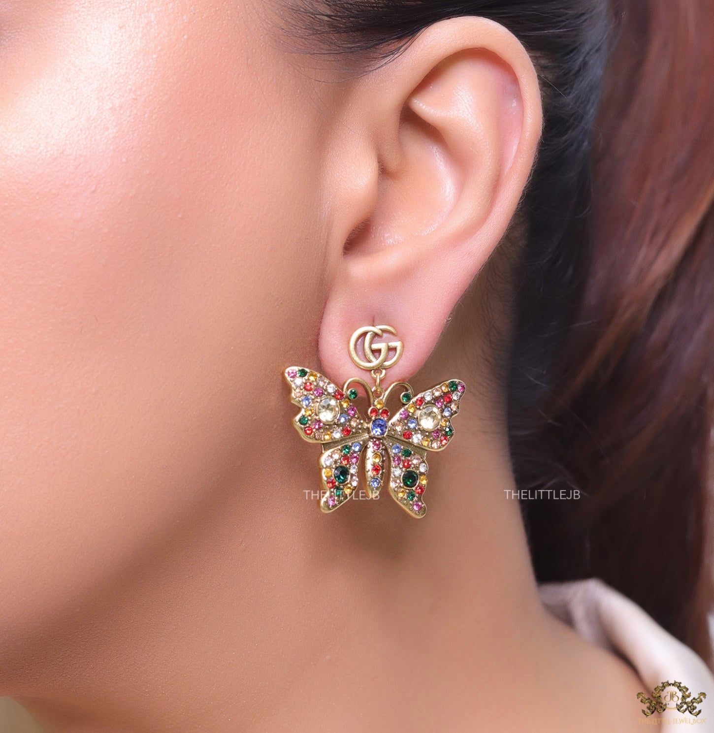 Gold plated twin G motif earrings with multi cz butterfly drops