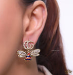 Pearl twin G earrings with pearl and multi cz bees in golden finish