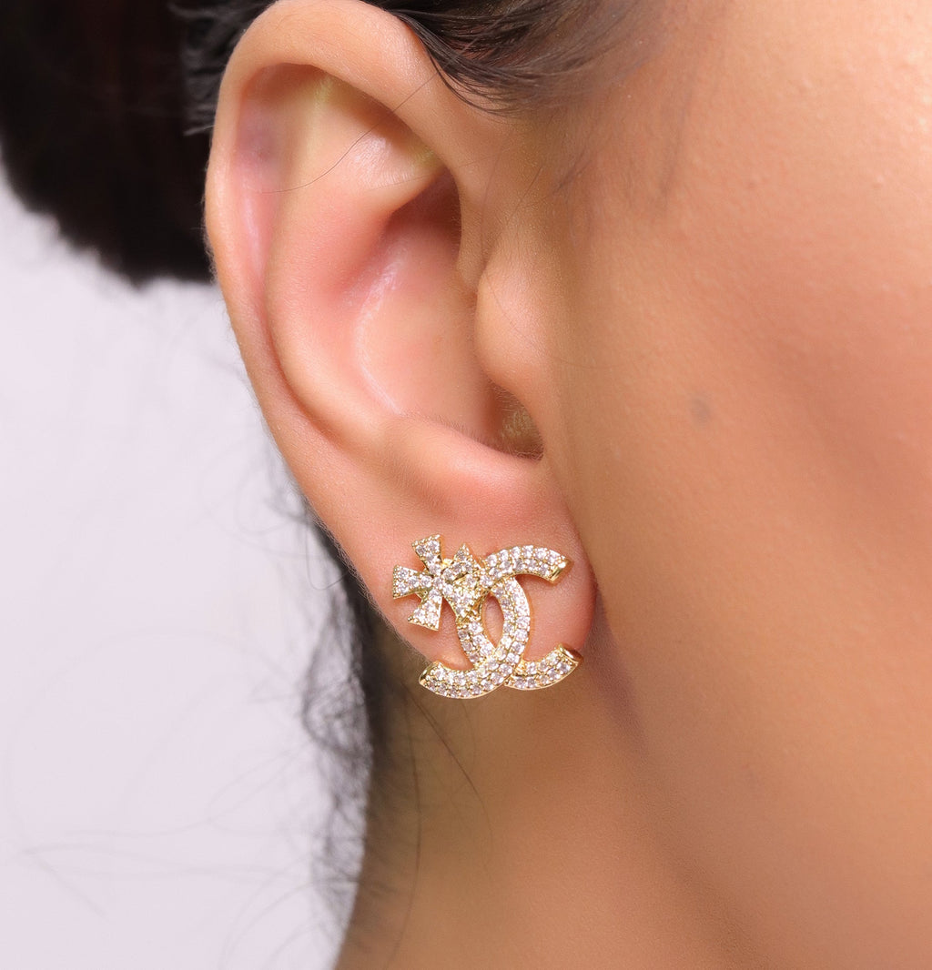 Gold plated flower and twin C motif cz studs