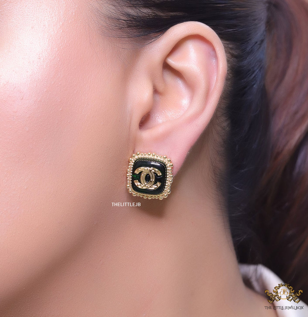 Square deep green and golden stud earrings with golden twin C motifs