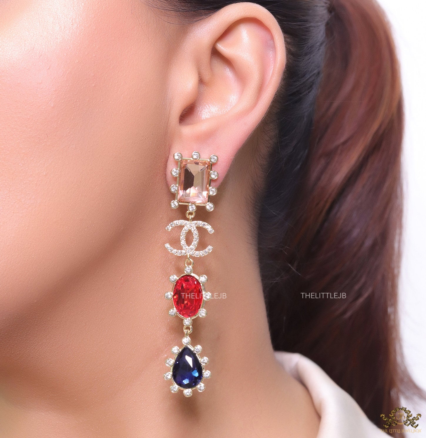 Gold plated cz dangles with red and blue stones and fancy cut cz