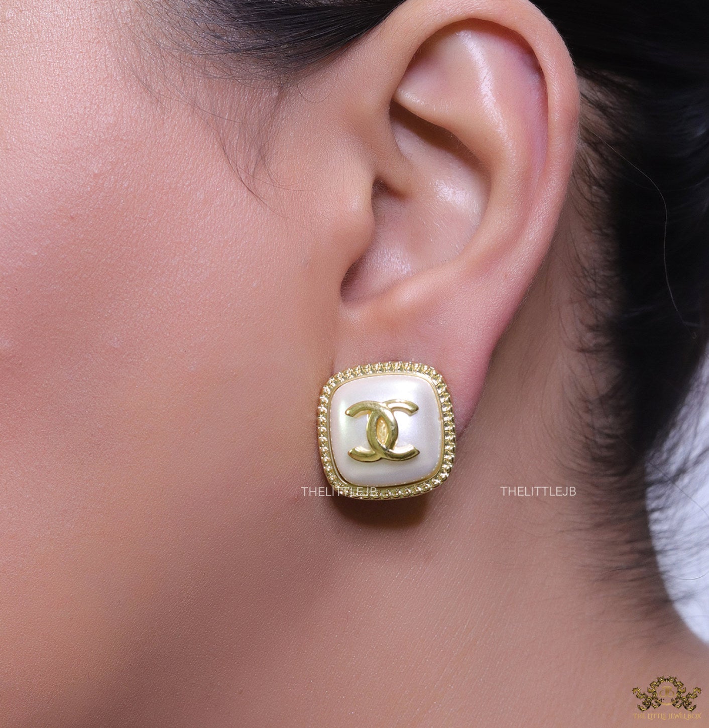 Twin C motif square studs in golden and MOP finish