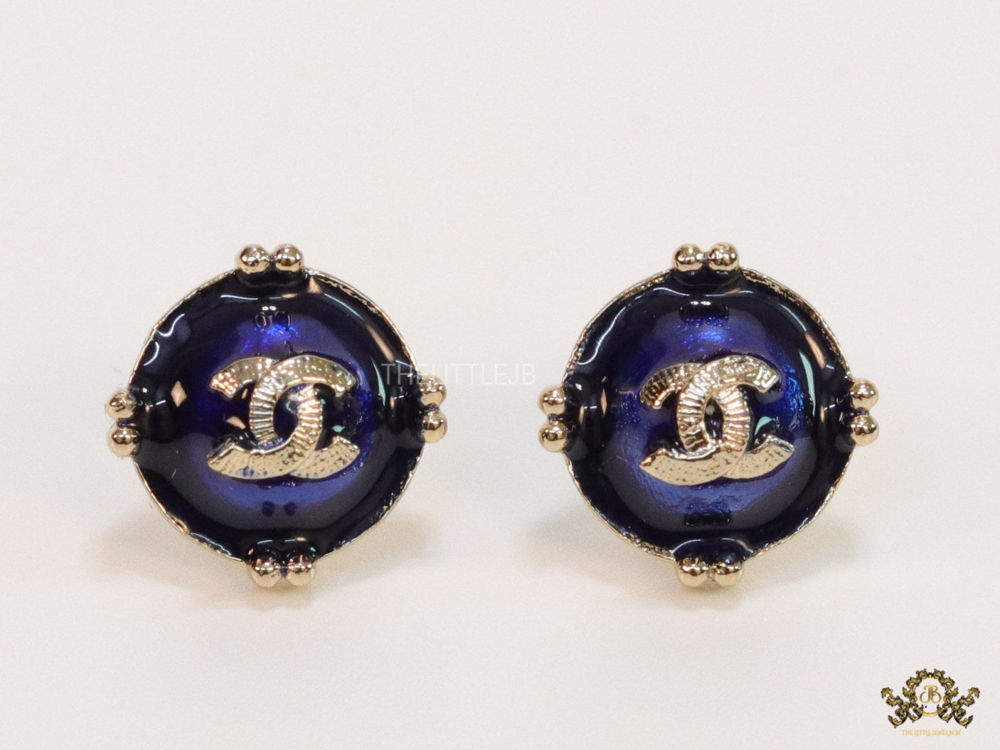 Royal blue studs with double C in centre