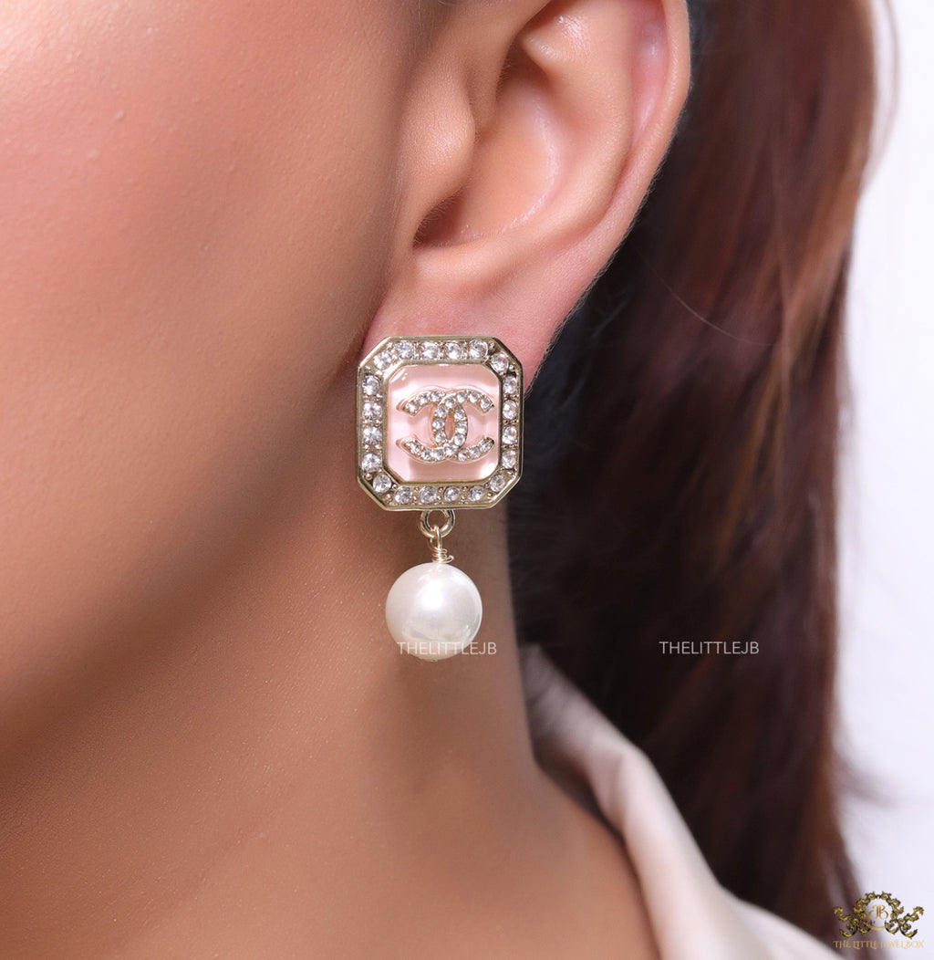 Light pink pearl drop earrings with twin C motif in cz