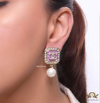 Purple pearl drop earrings with twin C motif in cz