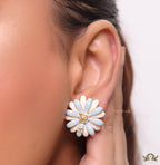 Off-white and soft blue daisy studs with golden details twin alphabet double C motif.