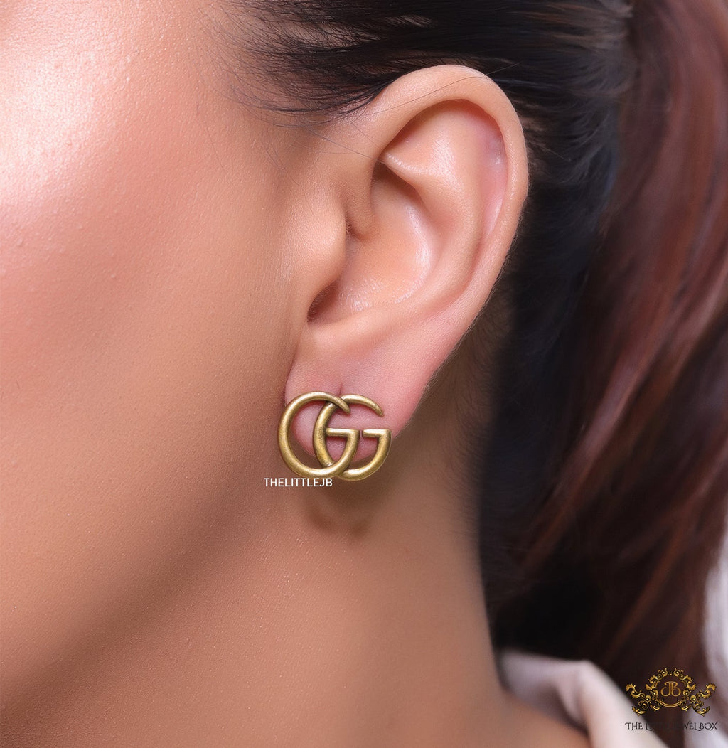 Gold plated twin G alphabet stud earrings