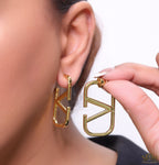 Designer golden earrings with alphabet motif