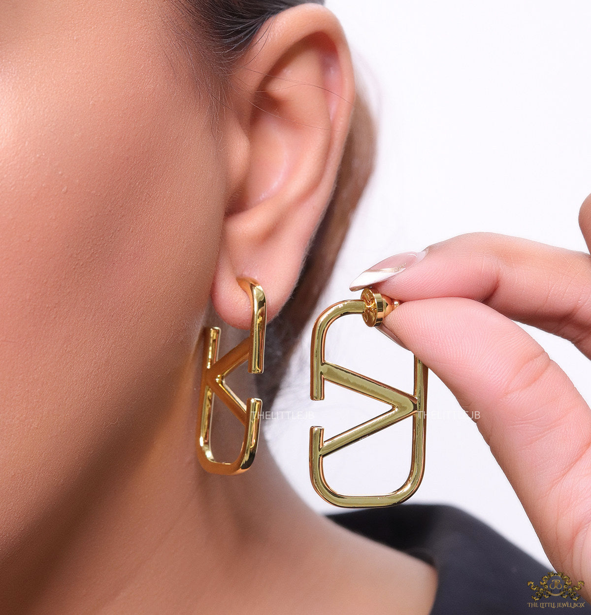Designer golden earrings with alphabet motif