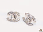 Platinum plated cz studs in twin C motif