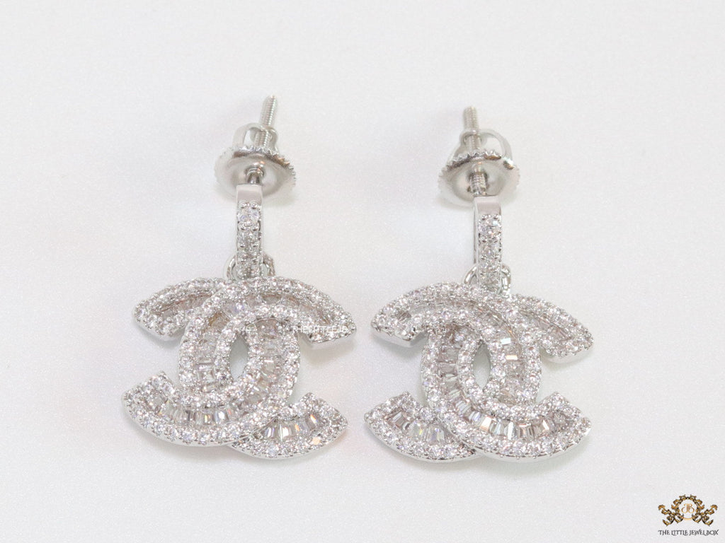 Platinum plated cz dangle earrings with twin C motif