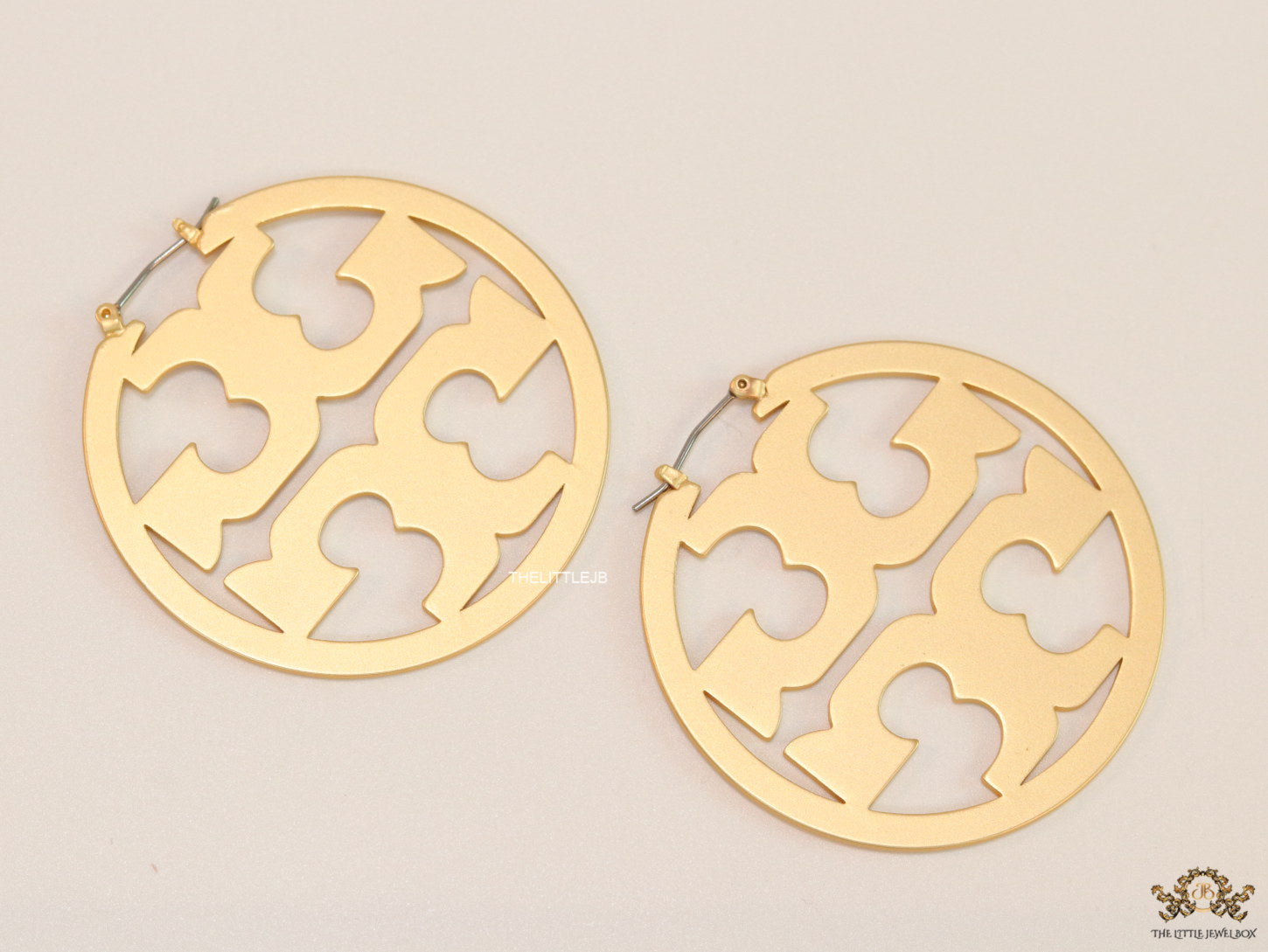 Matt Gold hoops with T motifs