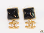 Black stone square earrings with twin C motif in gold plating