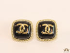 Twin C motif square studs in golden and black finish