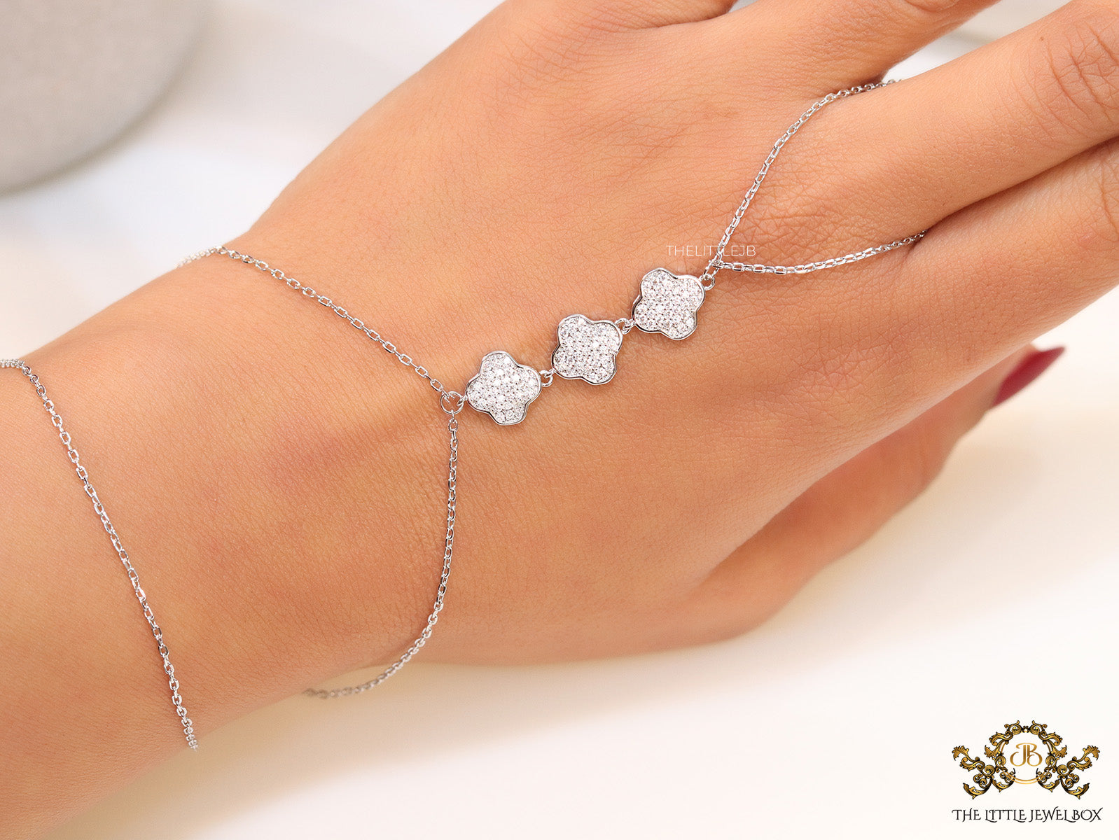 Platinum plated cz clover palm chain