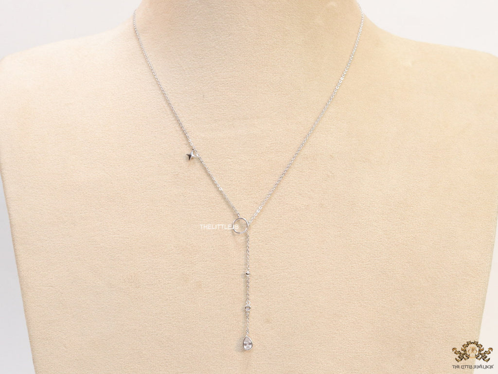 Platinum knot necklace with cz drop and small charms