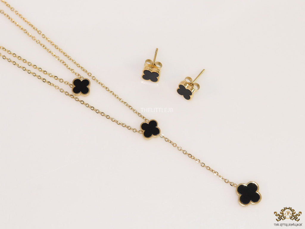 Dual chain necklace with black onyx clovers in gold finish