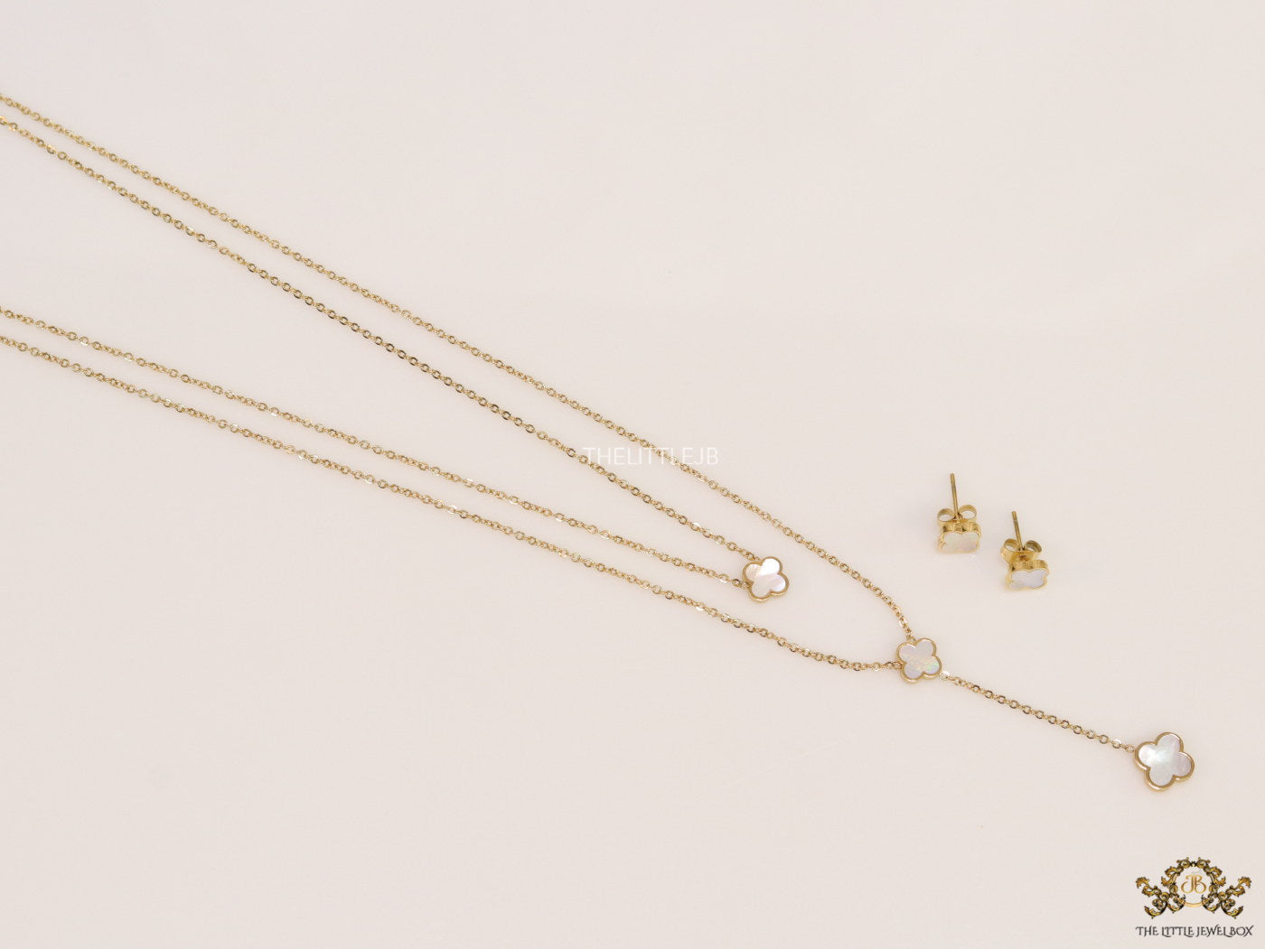 Dual chain necklace with white MOP clover in gold finish