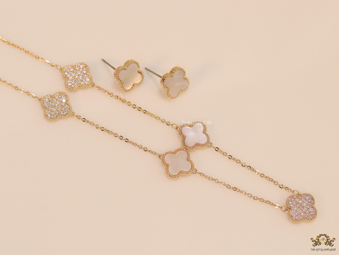 Gold plated necklace set with cz and mother of pearl clovers