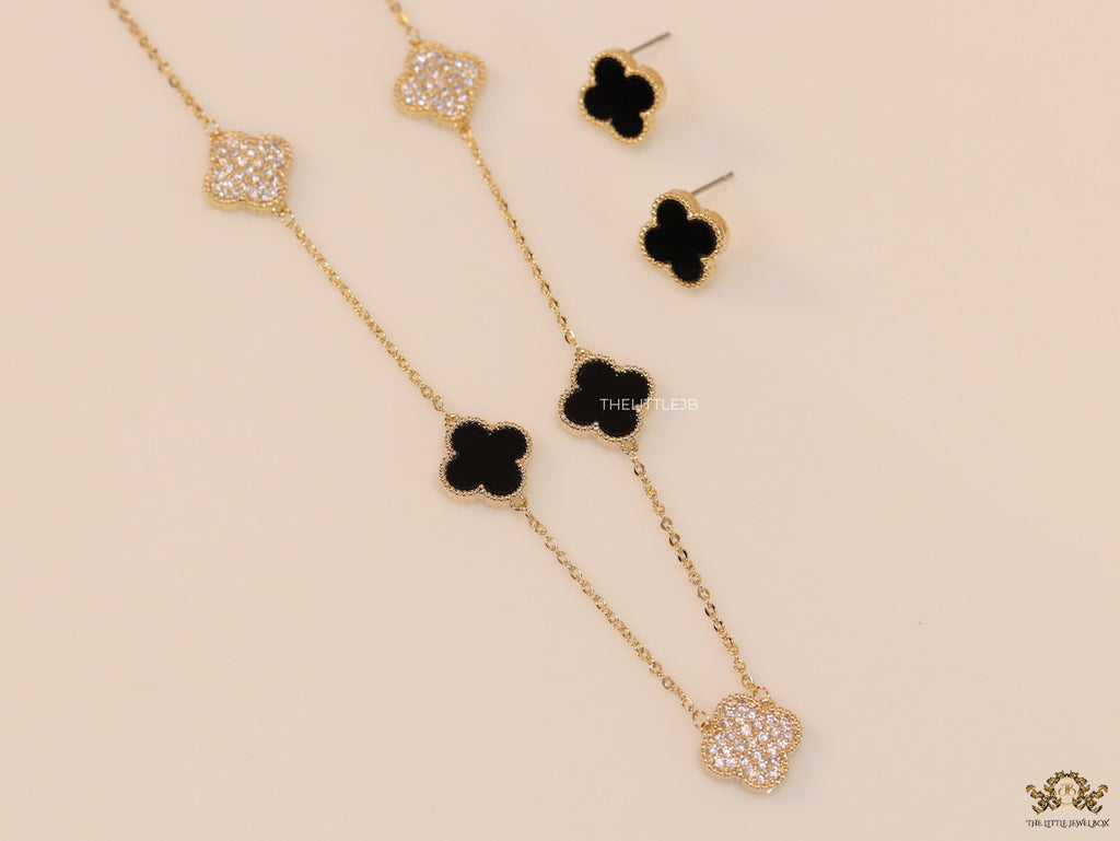Gold plated necklace set with cz and black enamel coated clovers