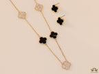 Gold plated necklace set with cz and black enamel coated clovers