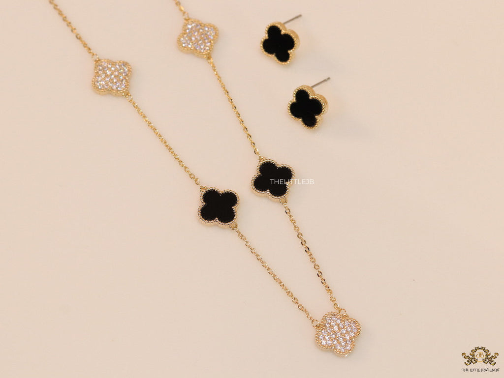 Gold plated necklace set with cz and black enamel coated clovers