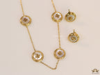 Gold plated necklace set with T motif mother of pearl discs