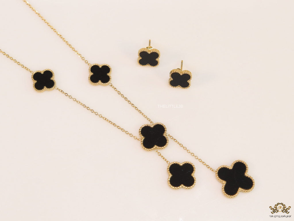 Gold plated necklace set with black enamel coated clovers