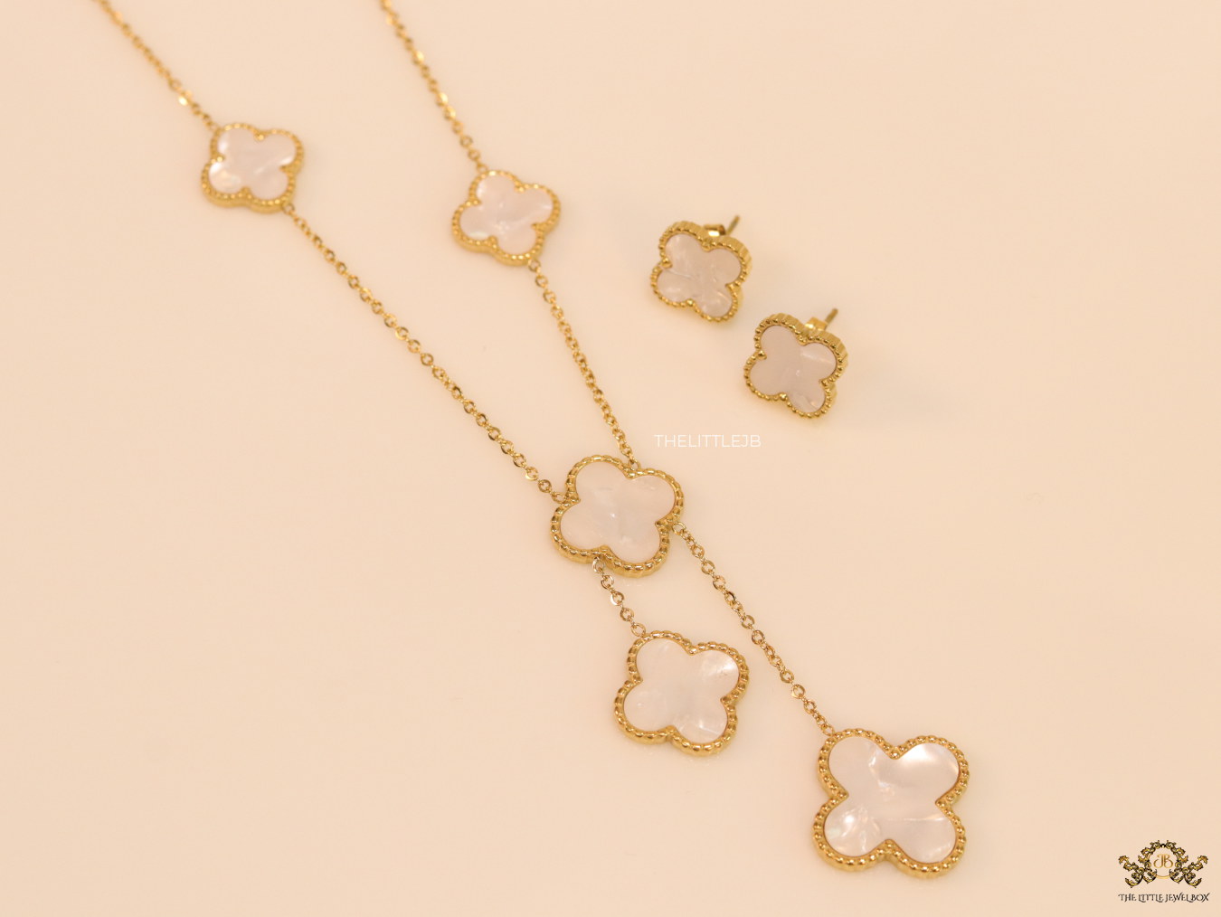 Gold plated necklace set with mother of pearl clovers