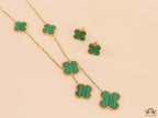 Gold plated necklace set with malachite green clovers