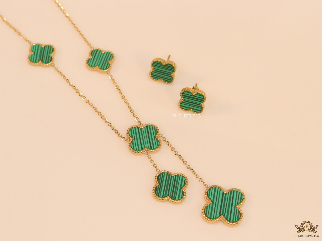 Gold plated necklace set with malachite green clovers