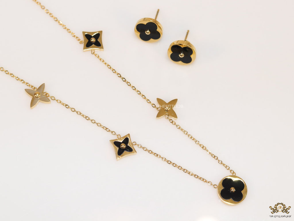 Clover necklace set in black enamel and gold plating
