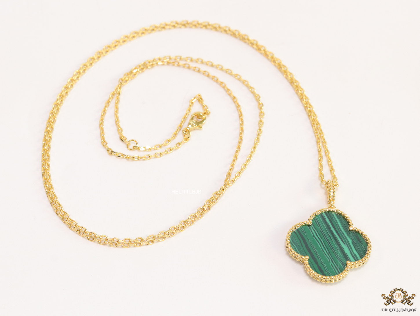Malachite green clover pendant in gold plated chain