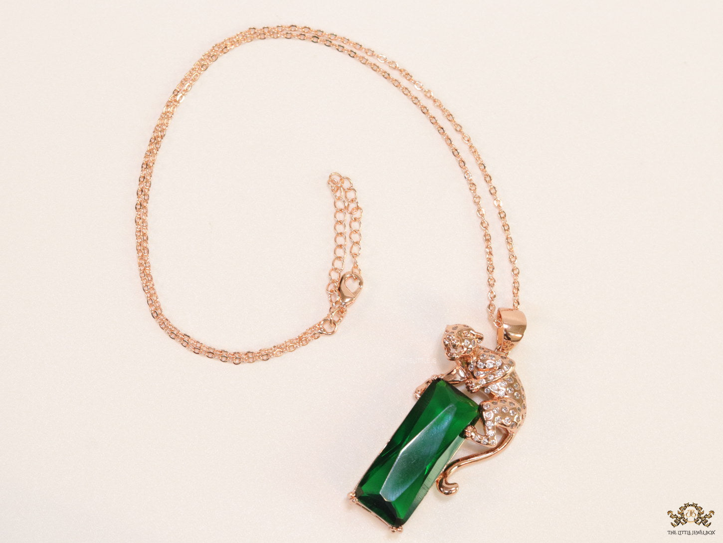 Rose gold plated leopard on green stone pendant necklace with cz