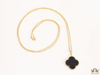 Black enamel clover pendant in gold plated chain