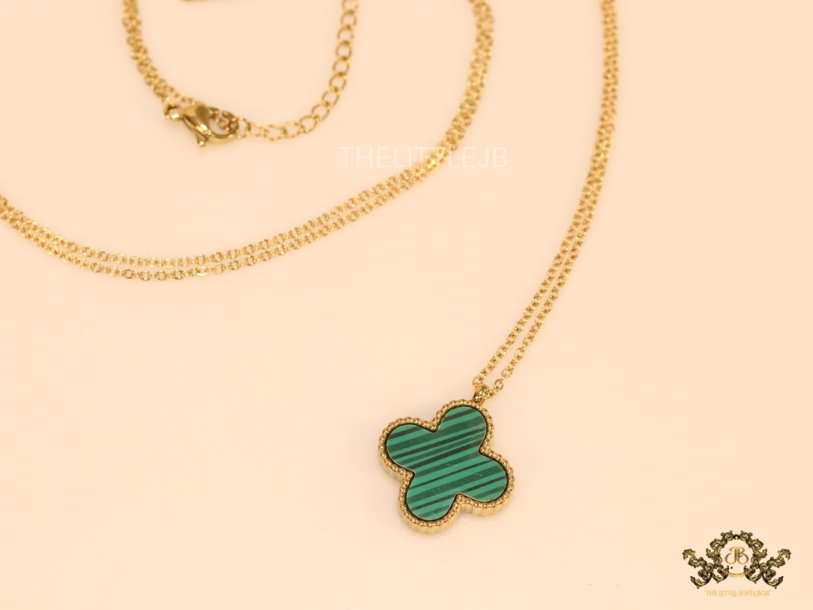 Gold plated chain with malachite stone clover pendant