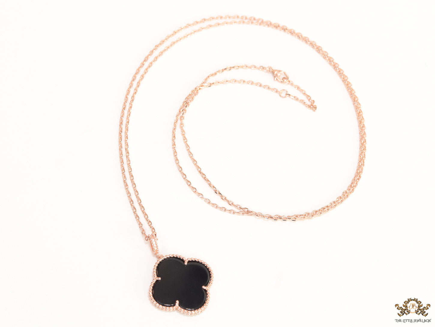 Black enamel clover pendant in rose gold plated chain