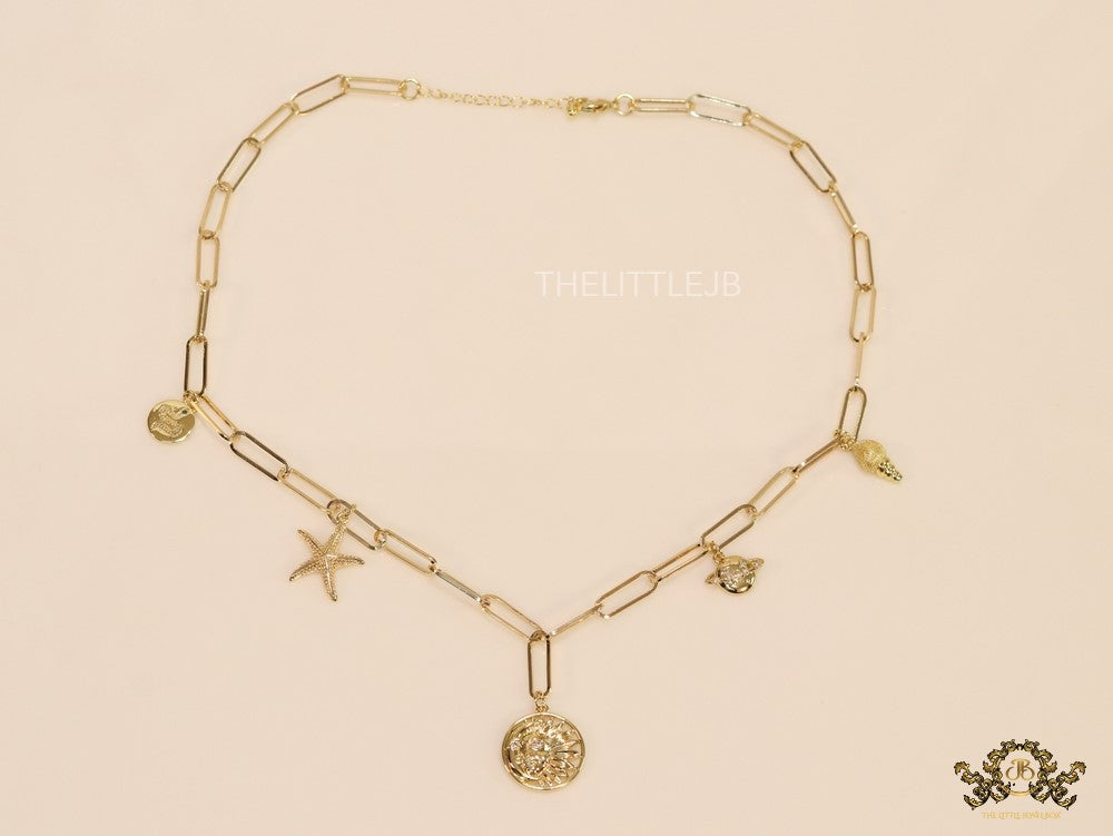 Gold plated link chain necklace with charms- snake, star fish, saturn, snail shell, Sun n Moon