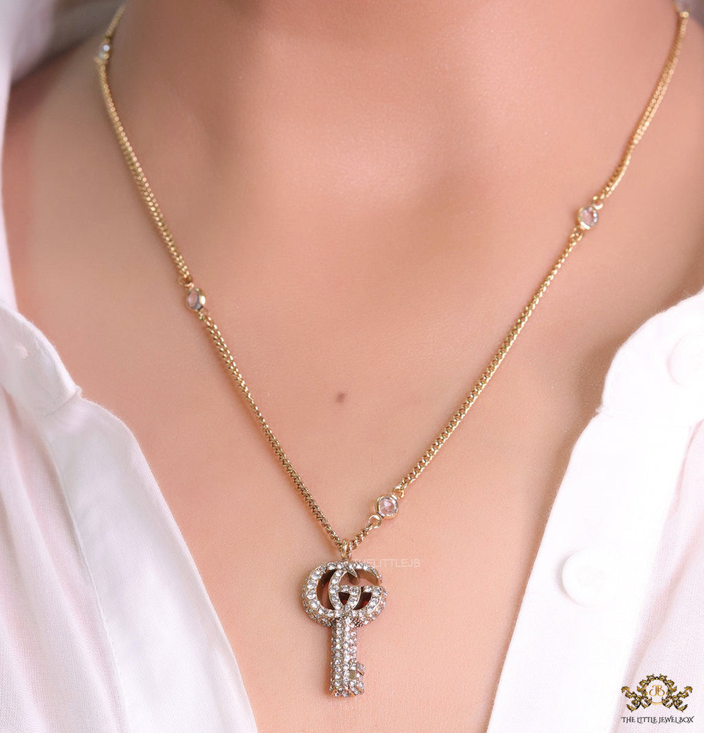 Gold plated chain necklace with cz G and key pendant
