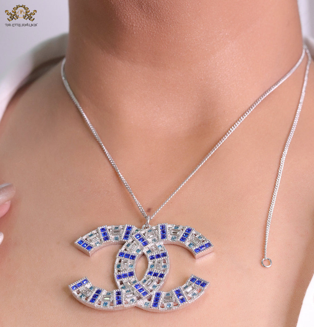 Platinum chain alphabet necklace with coloured cz