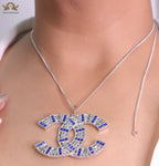 Platinum chain alphabet necklace with coloured cz