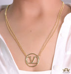 Dual chain golden necklace with alphabet pendant