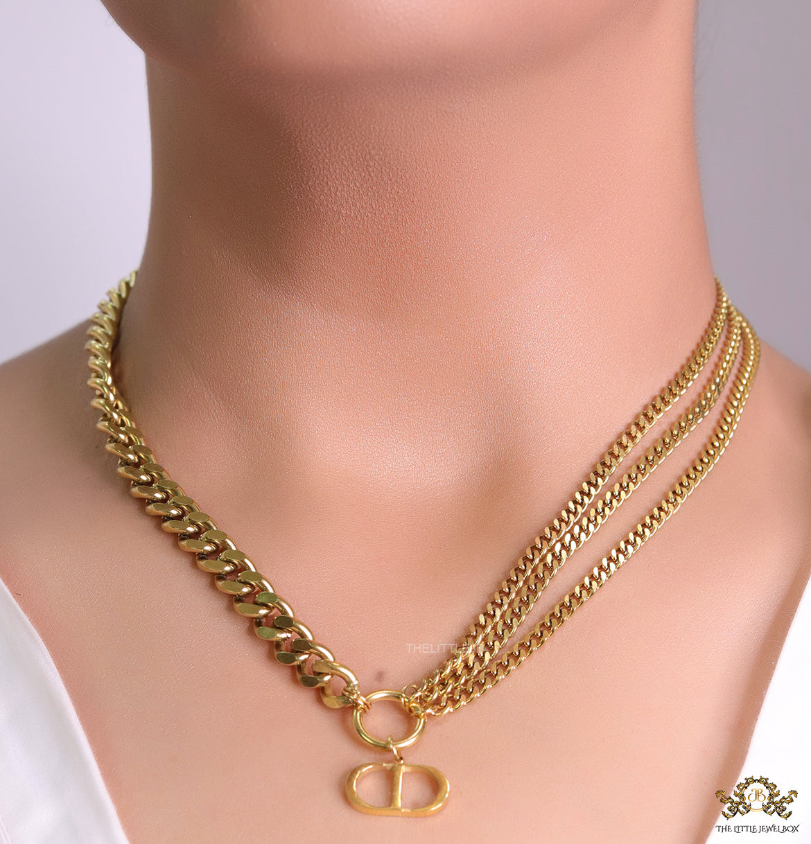 Multiple golden chain necklace with alphabet pendant